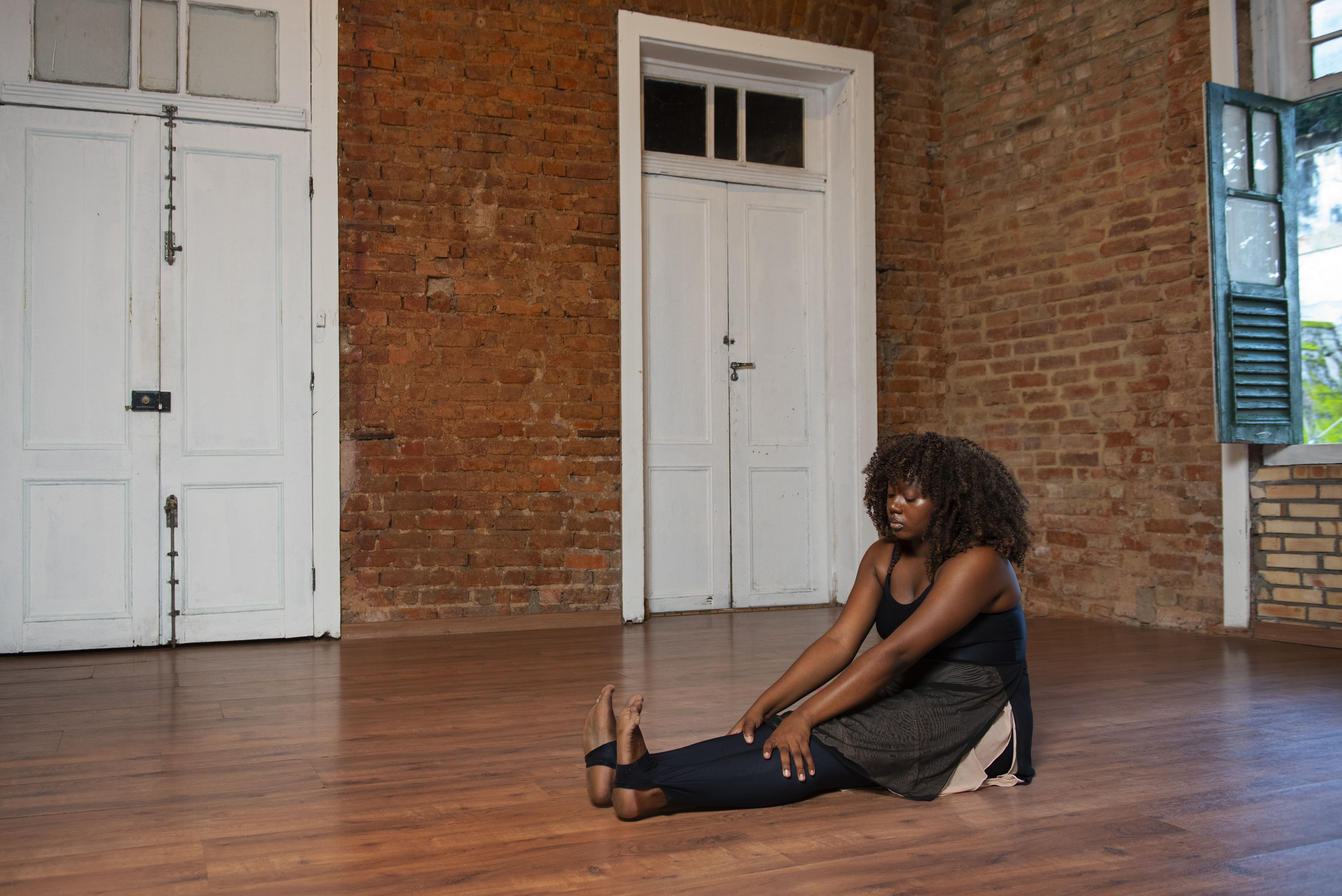 Person practicing yoga at home